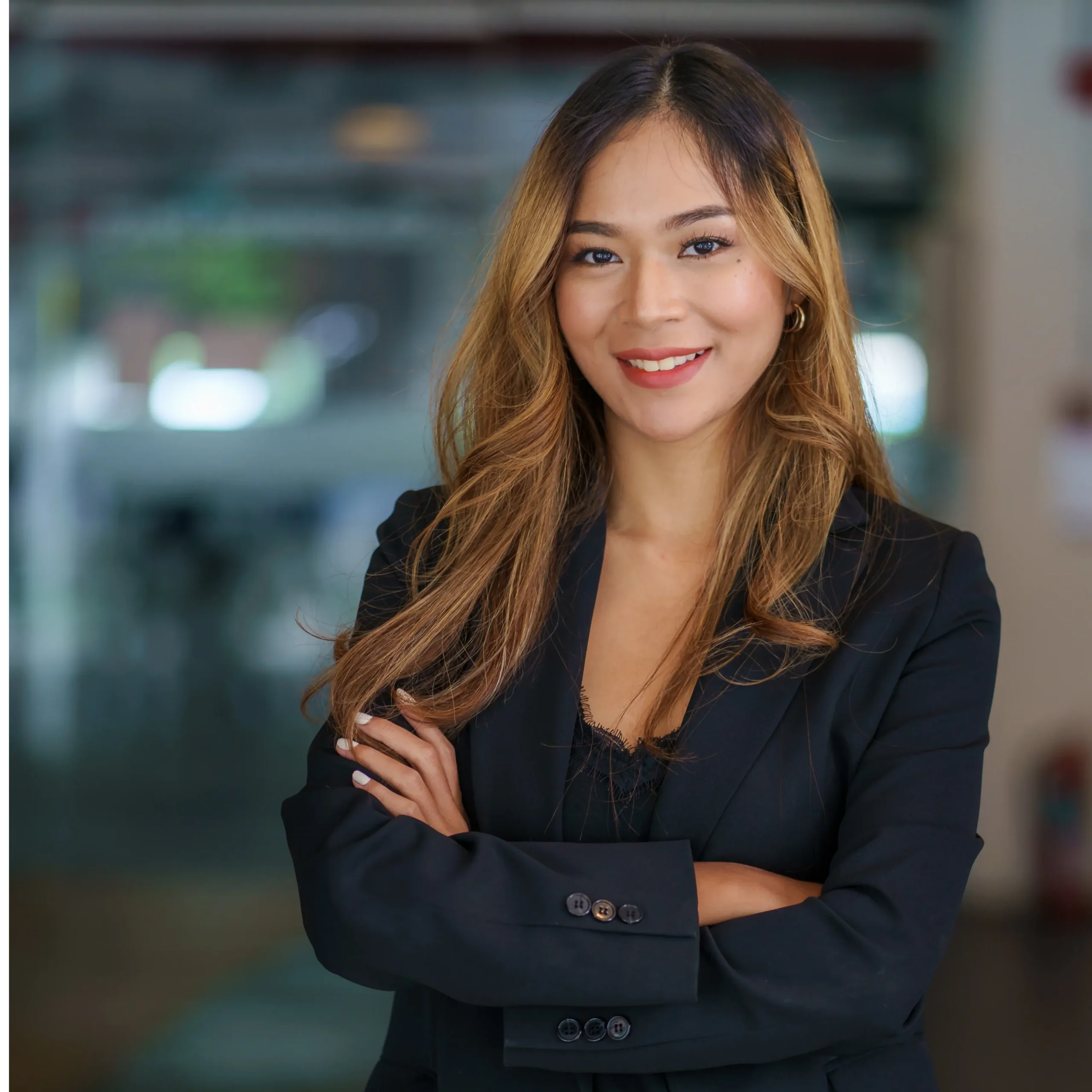 A confident senior account manager at our onlyfans agency posing in a professional office setting, dedicated to overseeing creator growth and long-term success.